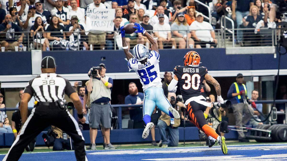 Dallas Cowboys wide receiver Noah Brown catches the ball for a touchdown as Cincinnati Bengals safety Jessie Bates III watches on Sunday, September 18, 2022, at AT&T Stadium.