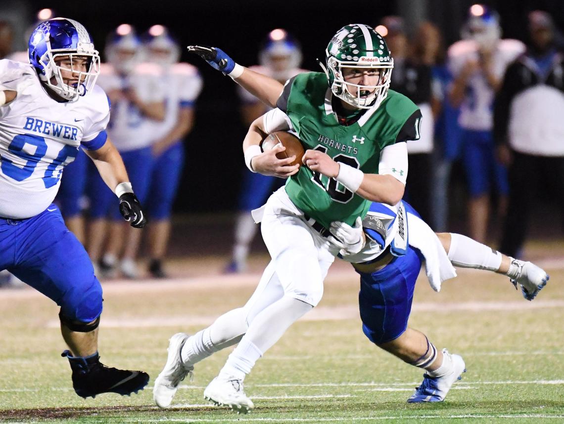 Azle quarterback Drey Owen, right, in action earlier this season against Brewer, and the Hornets fell to Lubbock Coronado 41-34 Friday in the Class 5A Division I area playoffs.