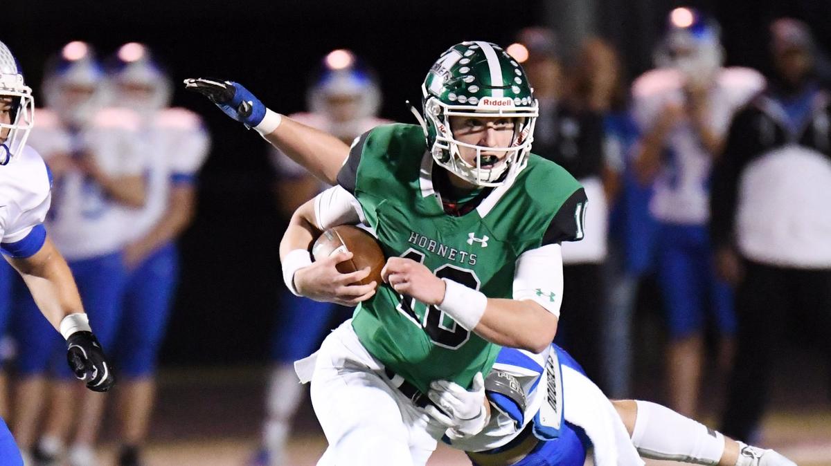 Azle quarterback Drey Owen, right, in action earlier this season against Brewer, and the Hornets fell to Lubbock Coronado 41-34 Friday in the Class 5A Division I area playoffs.
