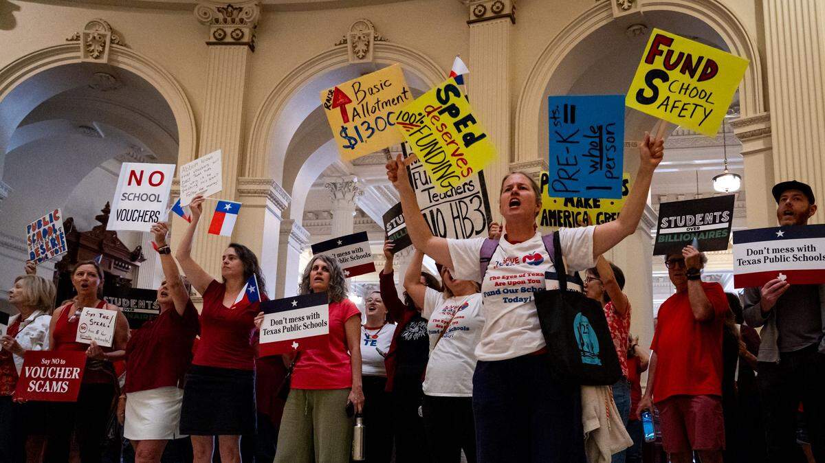 Protesters, including Leah Sanchez, a Pre-K teacher from Lewisville ISD, center, crowd the Texas State Capitol Rotunda to rally against school vouchers as the Texas State House of Representatives prepares to take up two major school funding bills- House Bill 2 and Senate Bill 2 on Wednesday, April 16, 2025. S.B. 2 would allow families to use taxpayer dollars to fund a child's education at an accredited private school while H.B. 2 focuses on funding for public schools.