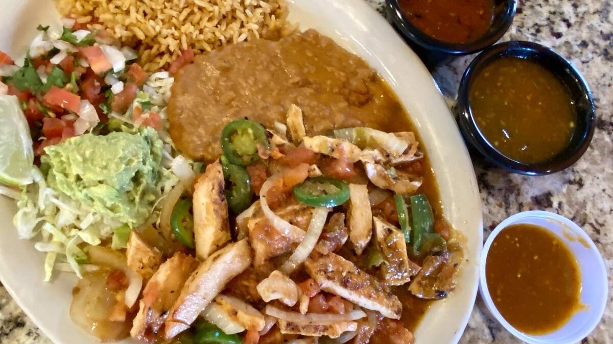 Fajitas “a la Mexicana” with Bernardo’s three salsas: chipotle, green and salsa “vaquero,” like a chile arbol.
