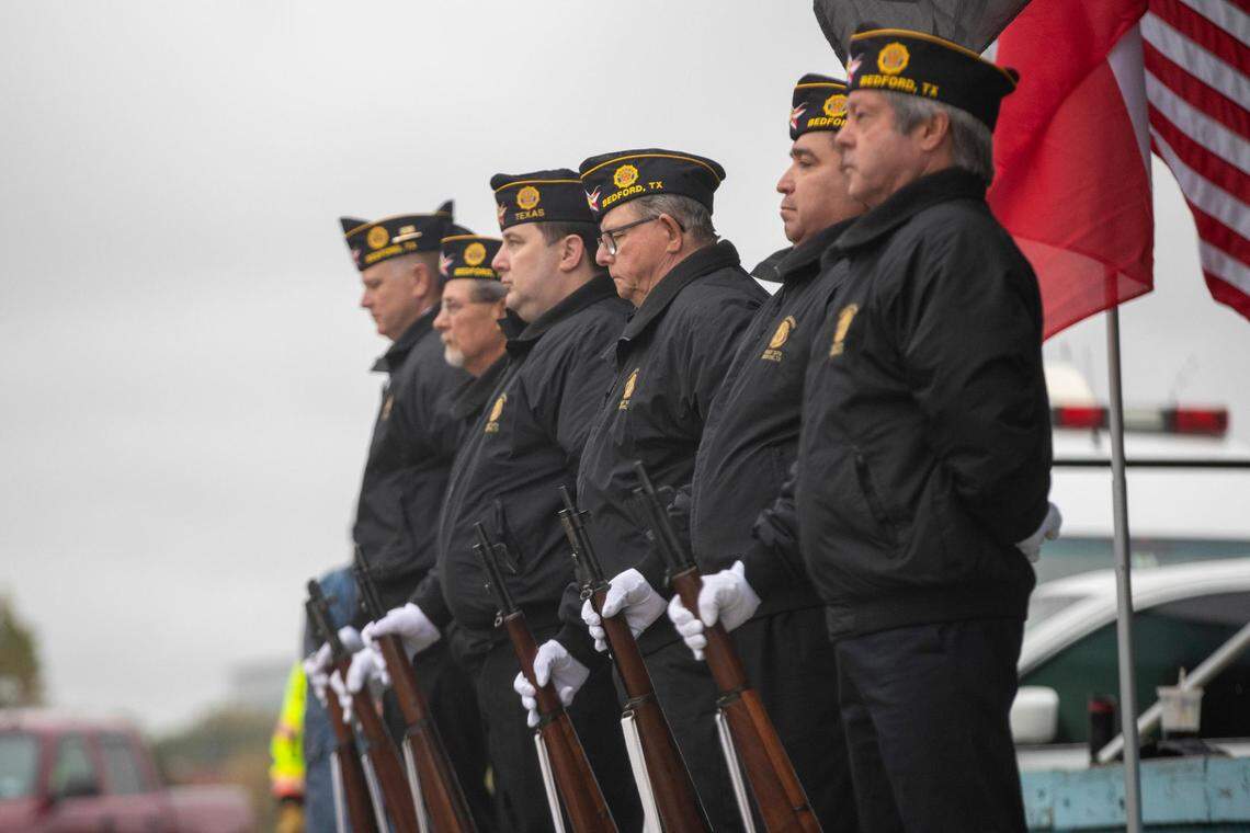 A prayer is held during gate introduction ceremony of the Veterans Day Parade in Fort Worth on Friday, Nov. 11, 2022. Despite rain, hundreds of participants marched down North Forest Park Boulevard, waving American flags and signing a medley of military songs.