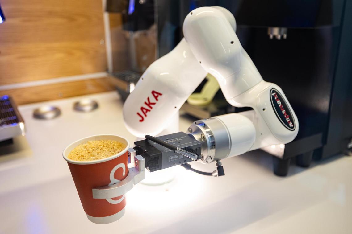 The new Ampersand coffee kiosk features a robotic arm and coffee machines programmed to create multiple different drinks in Terminal C of Dallas Fort Worth International Airport on Wednesday, March 26, 2025.