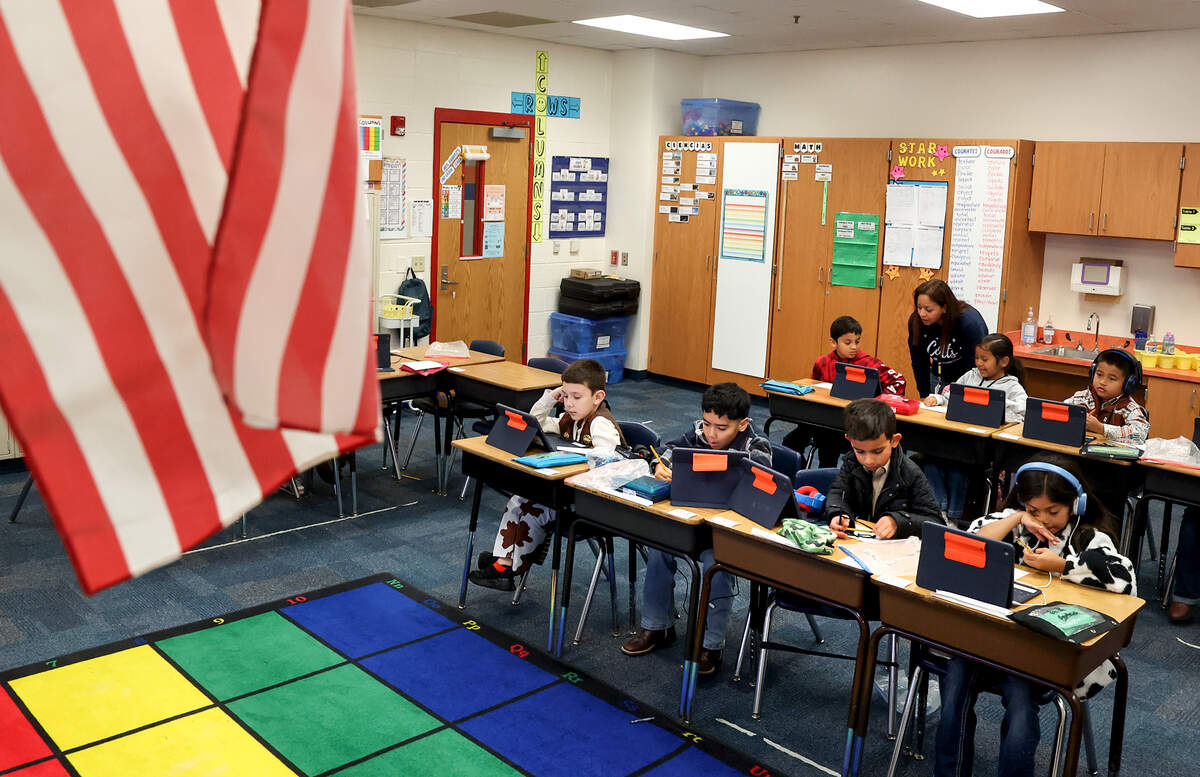 Teacher Patricia Ramirez helps her second-grade students work on an assignment at Cesar Chavez Elementary on Tuesday, Feb. 3, 2026, in Fort Worth.