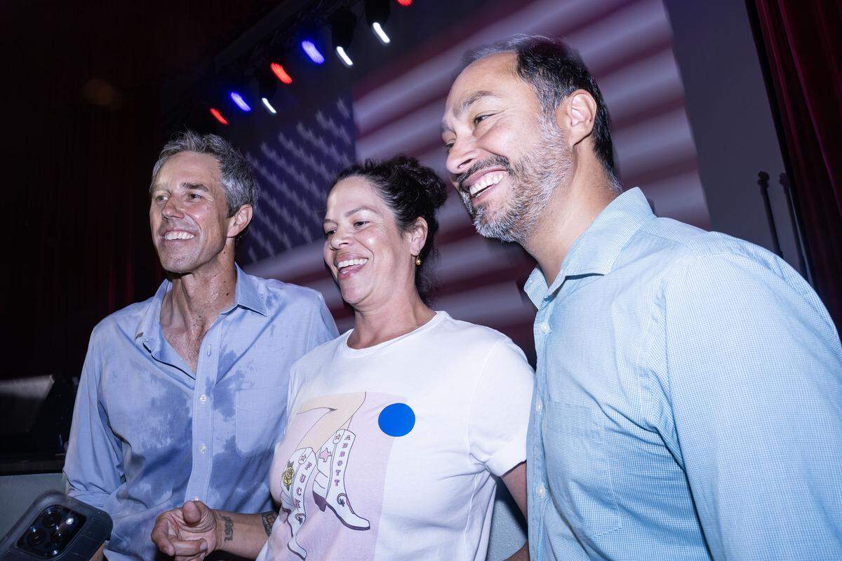 Former U.S. Rep. Beto O’Rourke, left, and U.S. Rep. Joaquin Castro, D-Texas, take photos with rally attendees during ‘The People vs. The Power Grab’ rally at the Ridglea Theater in Fort Worth on Saturday, Aug. 9, 2025.