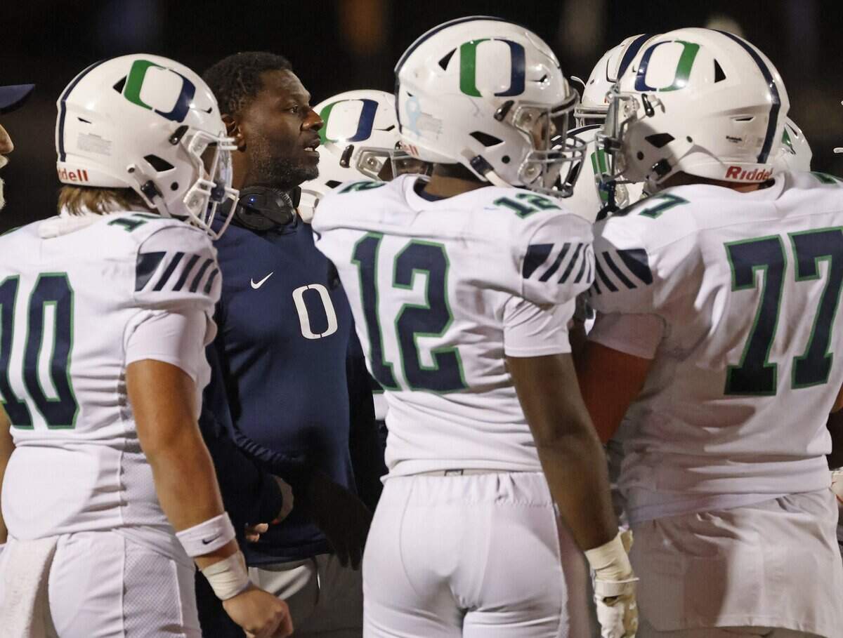 TCU great and Oakridge School run game coordinator LaDainian Tomlinson talks to the team during a timeout during the first half of the SPC 2025 3A Football Championship football game between The Oakridge School and Fort Worth Country Day at Mavericks Stadium in Arlington, Texas, Saturday Nov. 08, 2025.