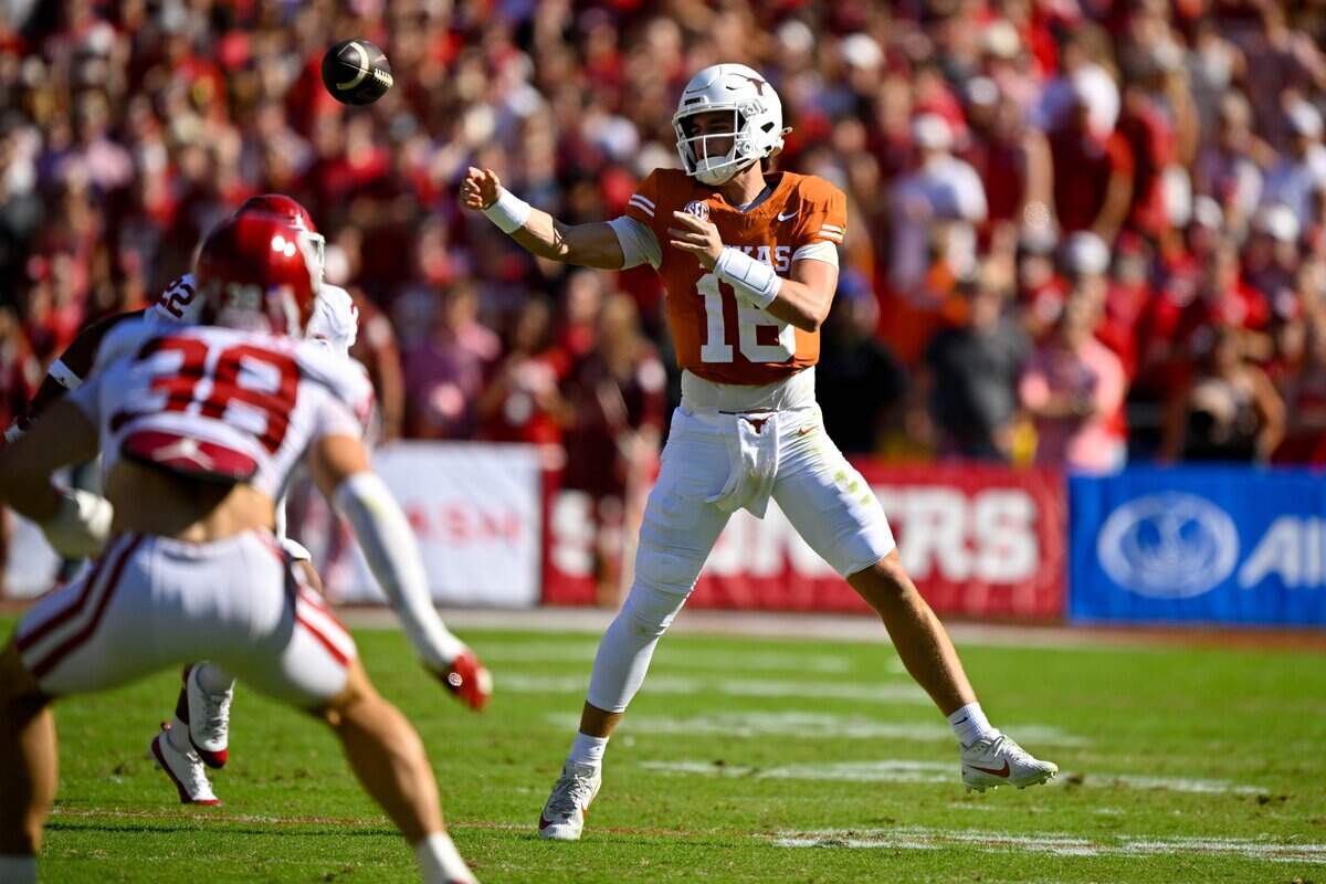 Oct 11, 2025; Dallas, Texas, USA; Texas Longhorns quarterback Arch Manning (16) throws the ball during the first half against the Oklahoma Sooners at the Cotton Bowl. Mandatory Credit: Jerome Miron-Imagn Images