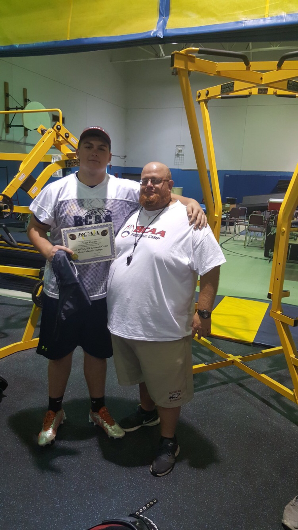 Corey Gaynor with his former high school coach, Aaron Feis.