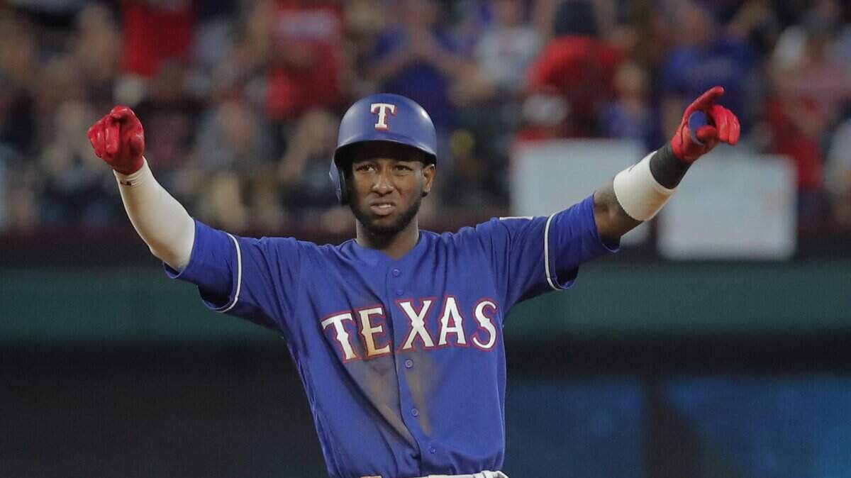 Jurickson Profar reacts after his three-run double in a four-run sixth inning that moved the Texas Rangers into an 11-10 lead. They beat the New York Yankees 12-10.
