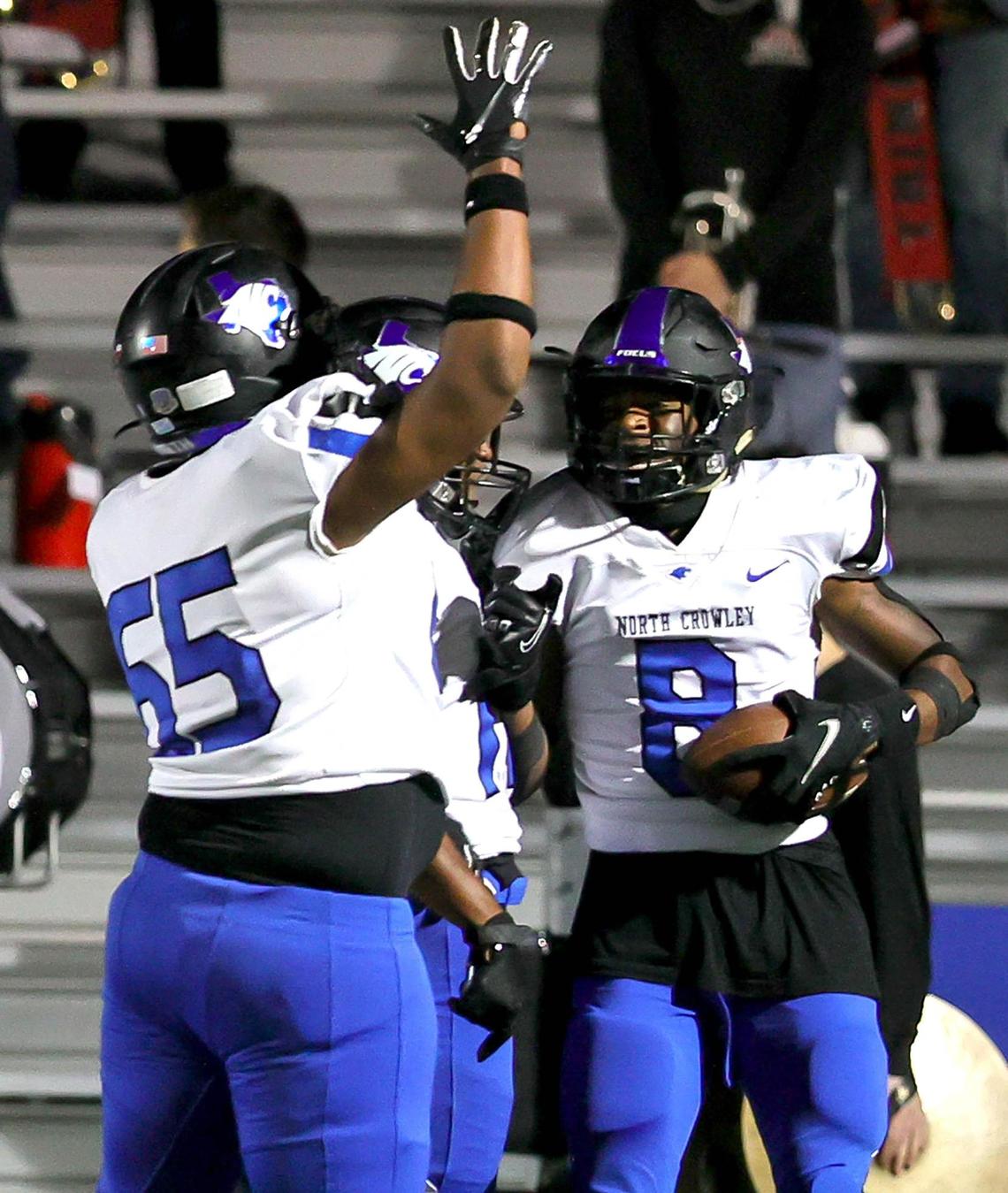North Crowley receiver Chance Beachum (8) celebrates with offensive lineman Kyren McCray (65) after his touchdown reception against Trinity during the first half of a high school football game, Thursday night, November 5, 2020 played at Pennington Field in Bedford, Tx. (Steve Nurenberg Special to the Star-Telegram)