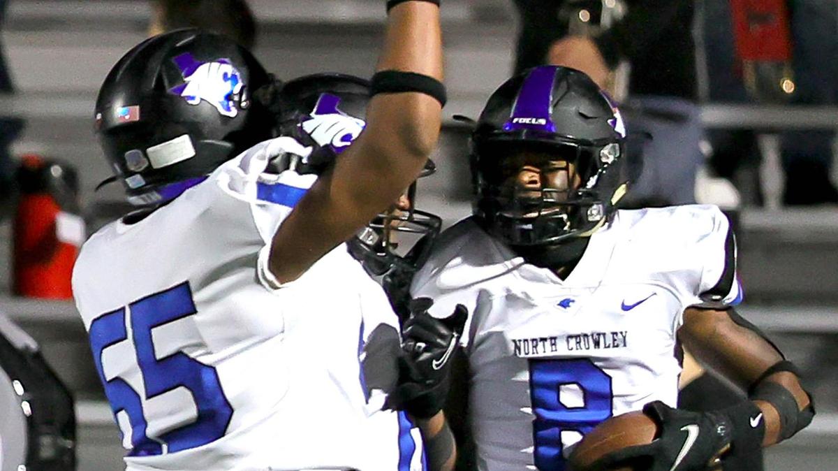 North Crowley receiver Chance Beachum (8) celebrates with offensive lineman Kyren McCray (65) after his touchdown reception against Trinity during the first half of a high school football game, Thursday night, November 5, 2020 played at Pennington Field in Bedford, Tx. (Steve Nurenberg Special to the Star-Telegram)