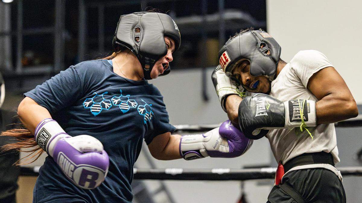 Sofia Reyna, 15, spars with Nick Brown at the Diamond Hill Community Center in Fort Worth. The boxing program has been a fixture at the center for decades, providing a source of discipline, structure and focus for young people.