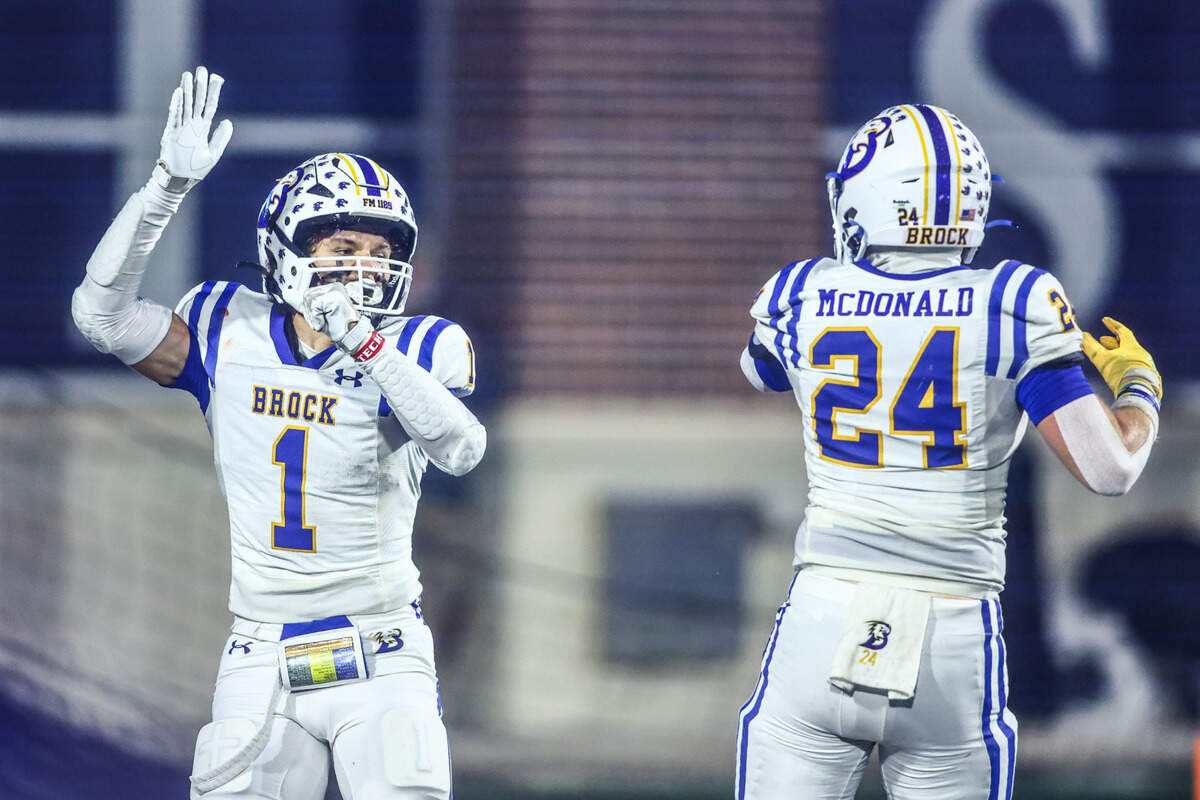 Brock’s Jesse Rustnek (1) celebrates his touchdown catch with Bryer McDonald in the 4A Division II state semifinal Friday, Dec. 13, playoff game at McKinney ISD Stadium.