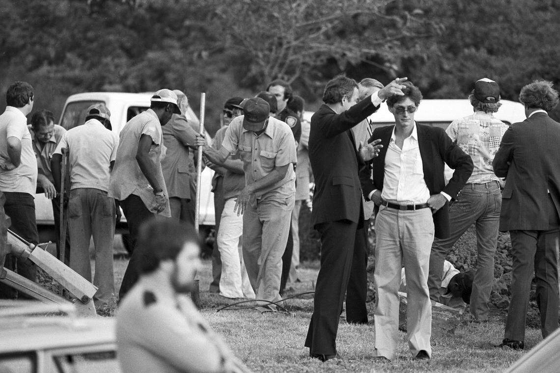 Oct. 4, 1981: A crowd of people, some with shovels, are seen attending the exhumation of Lee Harvey Oswald at Rose Hill Memorial Park in Fort Worth, Texas.