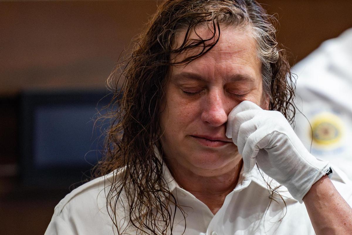 Tarrant County detention officer Amy King becomes emotional during a prayer to memory of the Vietnam veterans who served in the war during the 50th Anniversary of the Vietnam War event at Haltom City City Hall in Fort Worth on Wednesday, April 30, 2025. King’s father served in the Vietnam War.