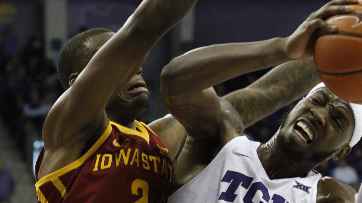 TCU forward JD Miller (15) goes up for the basket that put the Frogs ahead for good, defended by Iowa State forward Cameron Lard (2) with seconds left in the game. The Iowa State Cyclones played the TCU Horned Frogs in Big 12 men’s basketball at Schollmaier Arena in Fort Worth Saturday, Feb. 23.