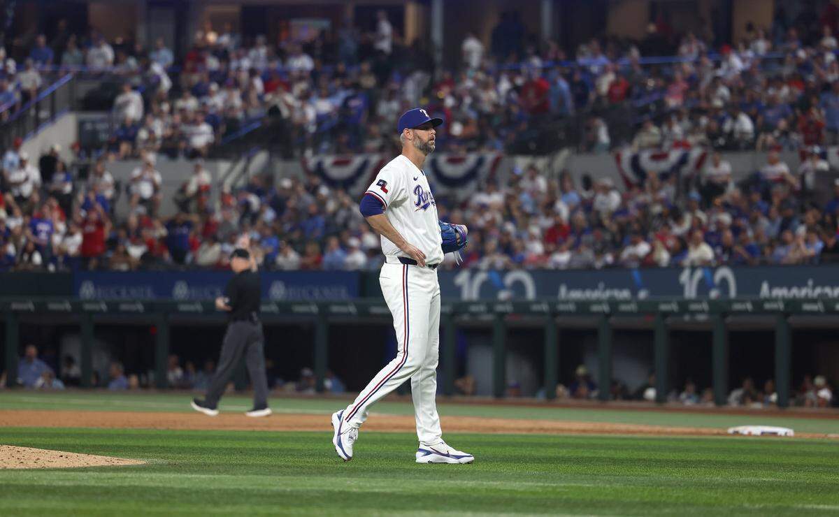Texas Rangers pitcher Chris Martin reacts after giving up a home run to the Cincinnati Reds in the ninth inning on Friday, April 3, 2026, at Globe Life Field.