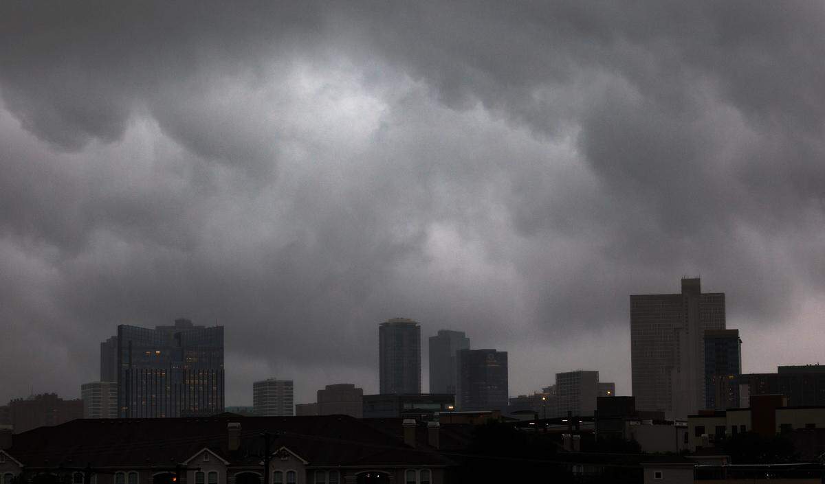 Storm clouds drop rain on downtown Fort Worth on Wednesday, April 30, 2025.