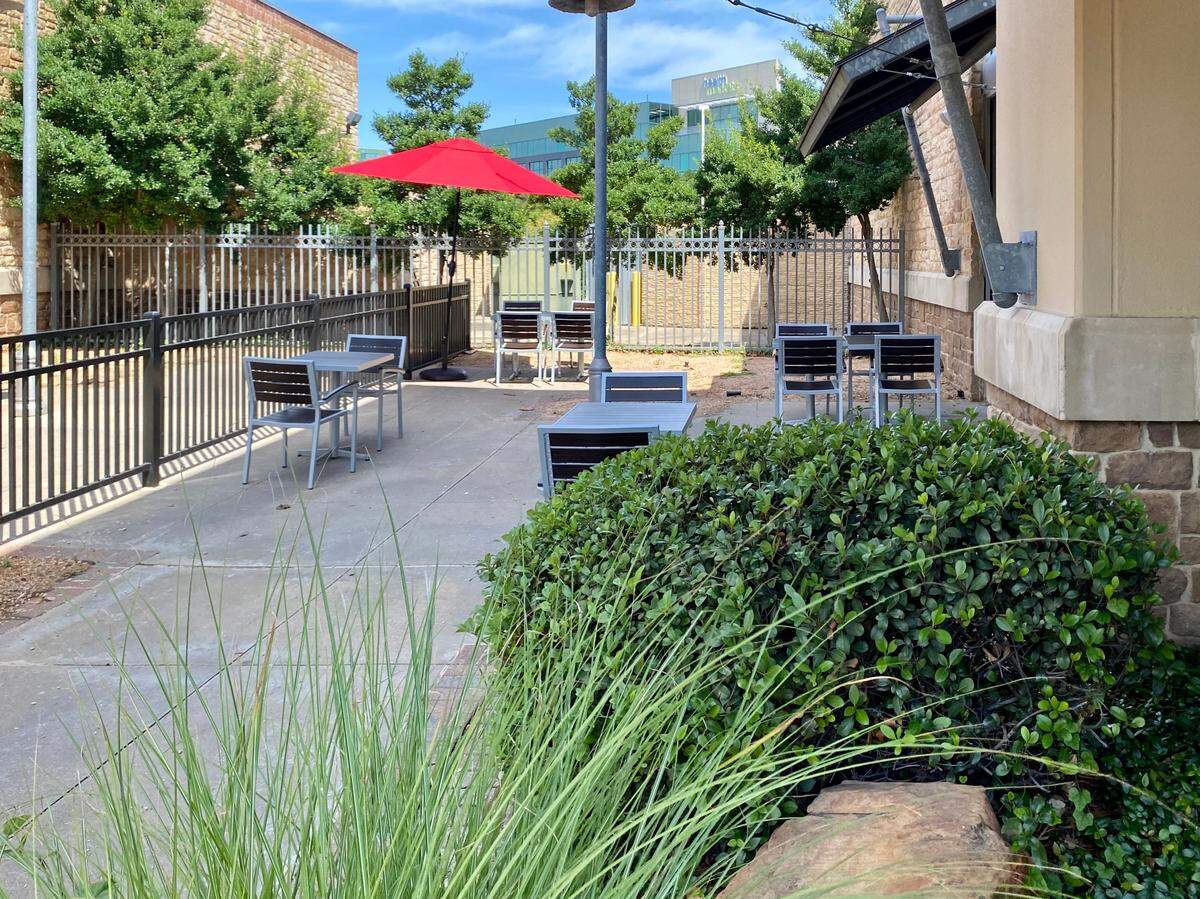 The carefully spaced patio at Fatburger in the Crossing.