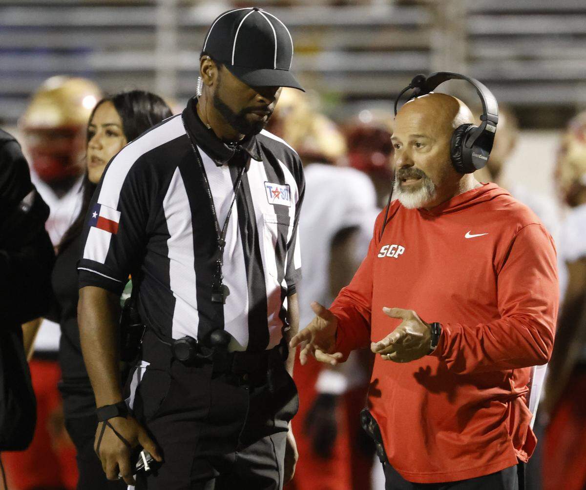 South Grand Prairie head coach Laban DeLay talks to the side judge during the second half of a UIL football game between South Grand Prairie and Arlington Bowie at UTA Maverick Stadium in Arlington, Texas, Thursday Nov. 06, 2025.