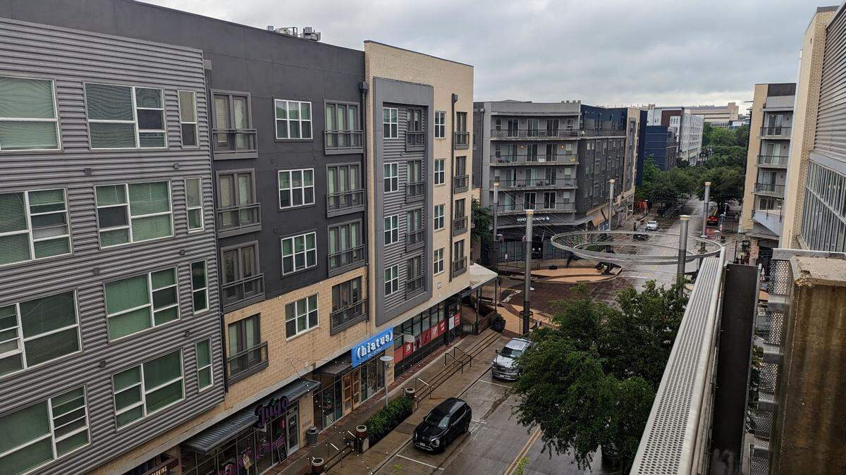 Crockett Street in Fort Worth viewed from the top floor of a parking garage on a rainy day. 