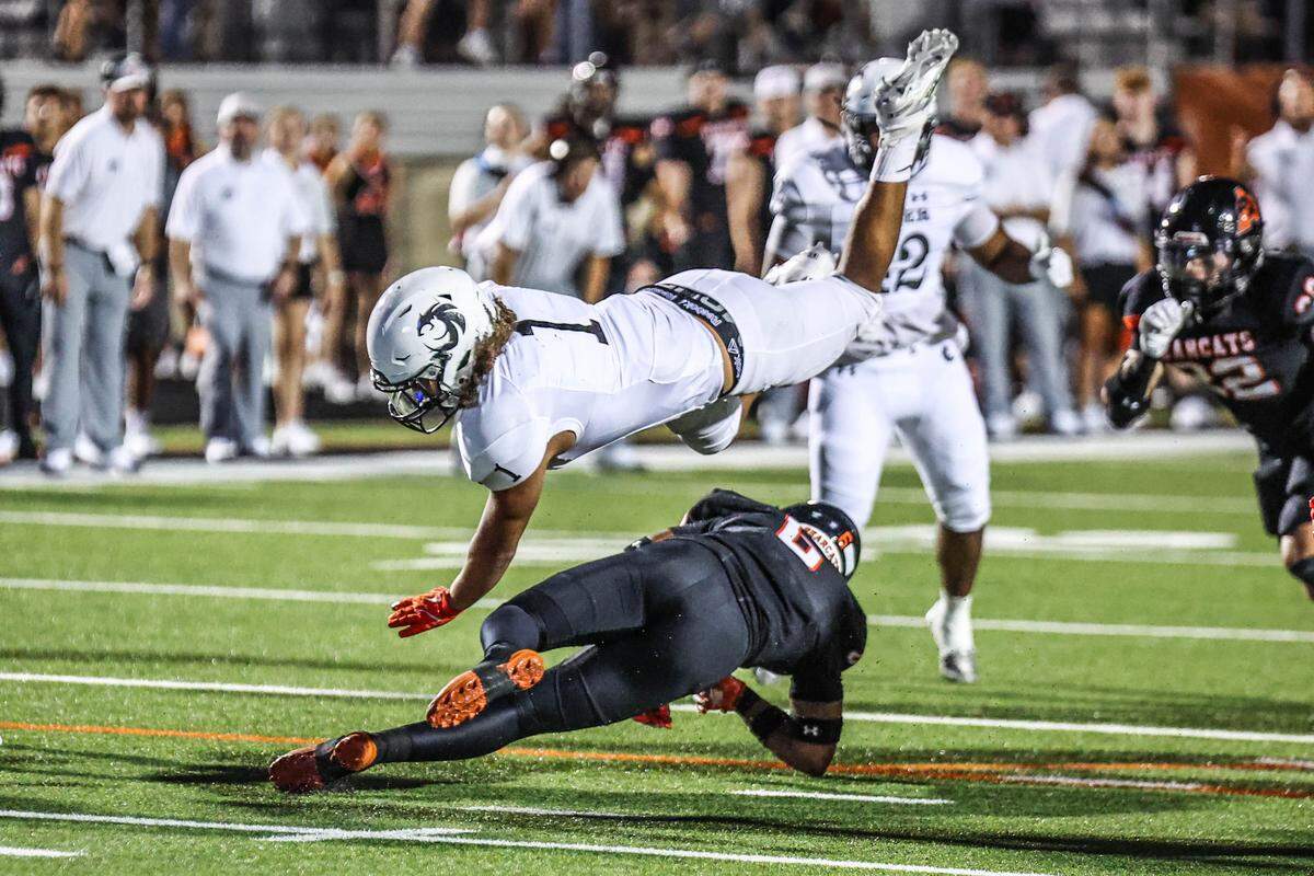 Denton Guyer’s Kaedyn Cobbs (1) is cut down by Aledo’s Lamel Swanson in a game at Tim Buchanan Stadium on Friday, Aug. 29, 2025.