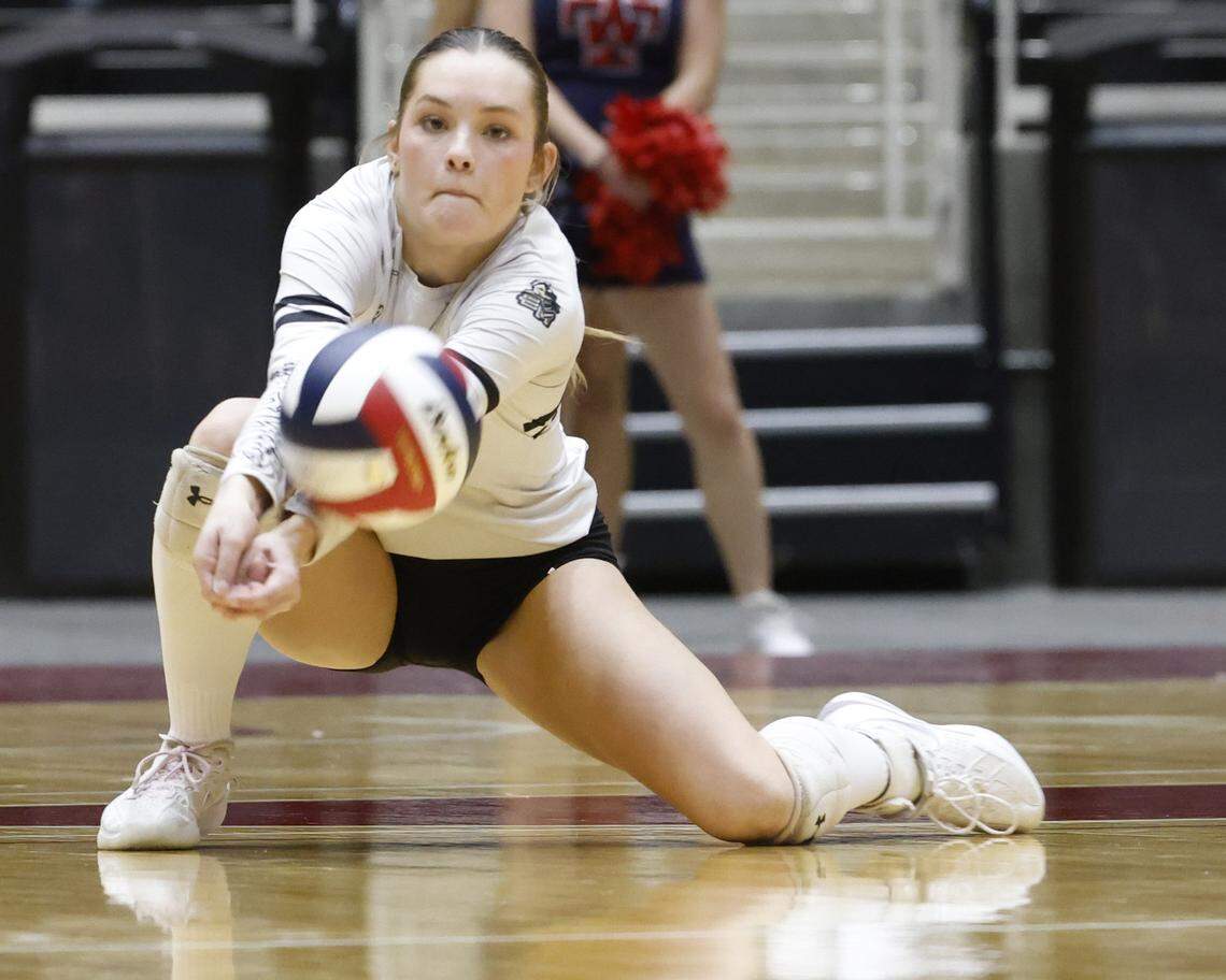 Fort Worth Eagle Mountain defensive specialist Lexi Nichols (4) digs out the ball during the second set of the UIL Class 4A Division II state volleyball championship game Friday Nov. 21, 2025 at Curtis Culwell Center in Garland, Texas.