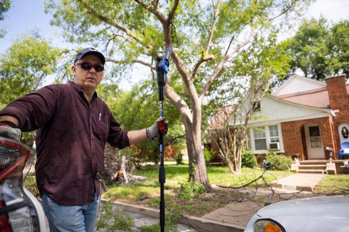 David Claire, trimming trees in front of his Fort Worth rental property, saw the values of his properties jump by 51% in the past year.