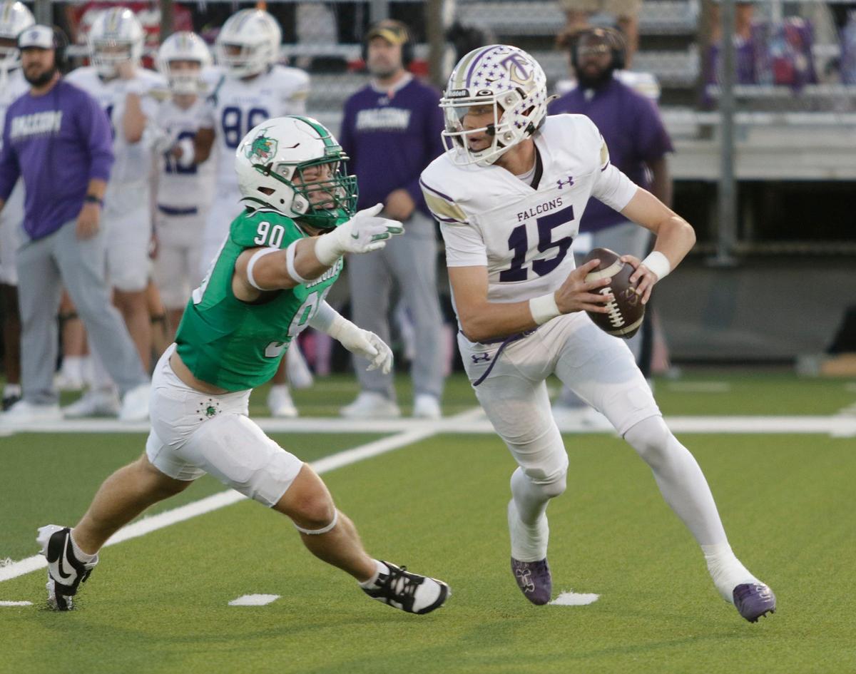 Timber Creek’s quarterback Carson Porter escapes Southlake Carroll’s Austin Davidge during a UIL football game at Dragon Stadium on Friday, Sept. 27, 2024.