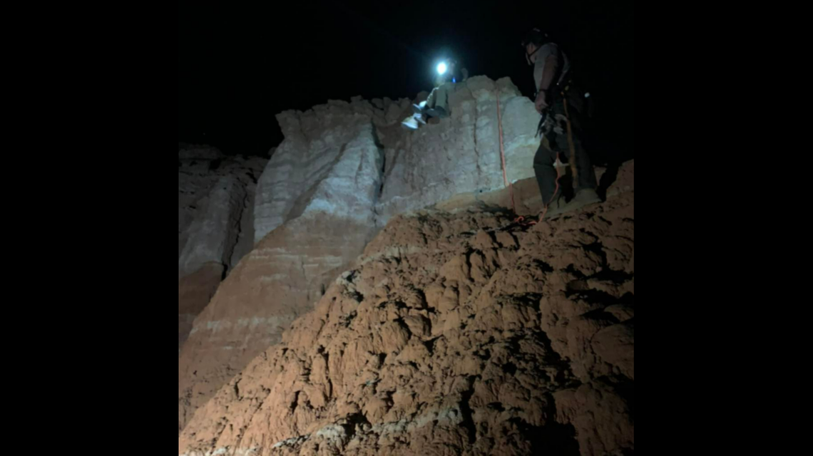 Rescue crews work to bring the hiker to safety.