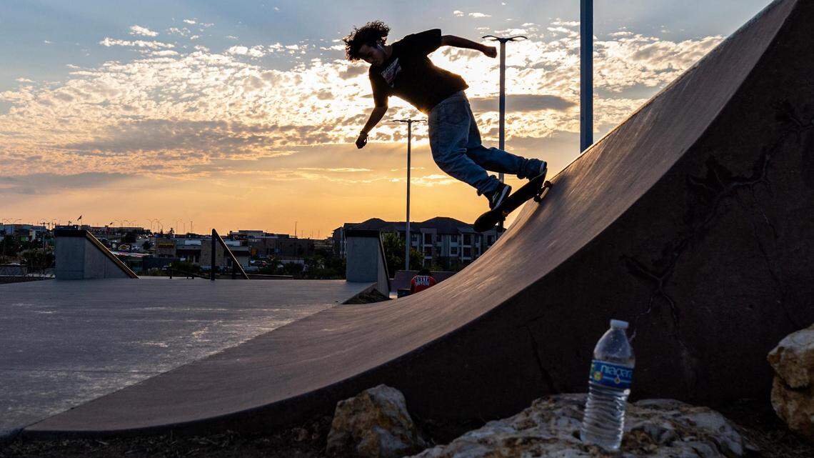 Kaleb Worthington skates up a slope at sunset at Chisholm Trail Skate Park in Fort Worth last August.