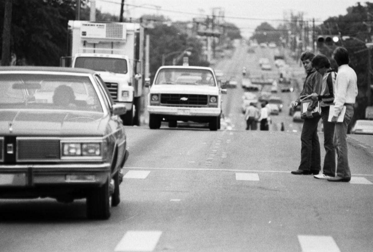 1984: A photograph of University of Texas at Arlington students trying to cross Cooper Street on campus.