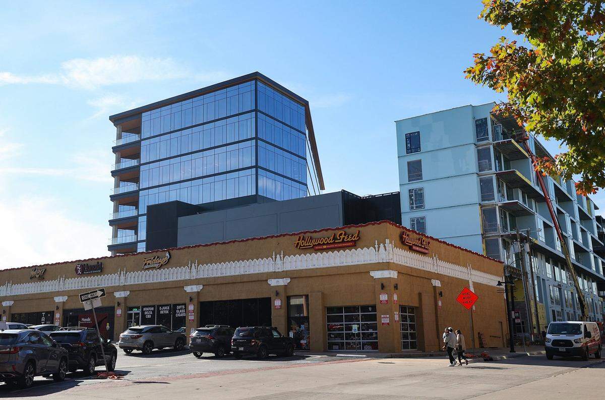 The Crescent Hotel rises above an older commercial building on W. Seventh Street in Fort Worth on Monday, November 27, 2023.