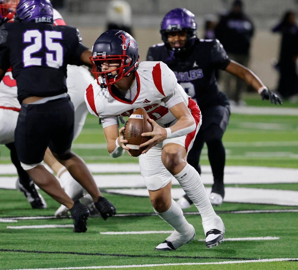 The fumble bounces back into the hands of Northwest quarterback Trey Poe (10) and he gained short yardage during a UIL Class 6A D2 Bi-district playoff football game at Crowley ISD Multi-Purpose Stadium in Fort Worth, Texas, Friday, Nov. 15, 2024.