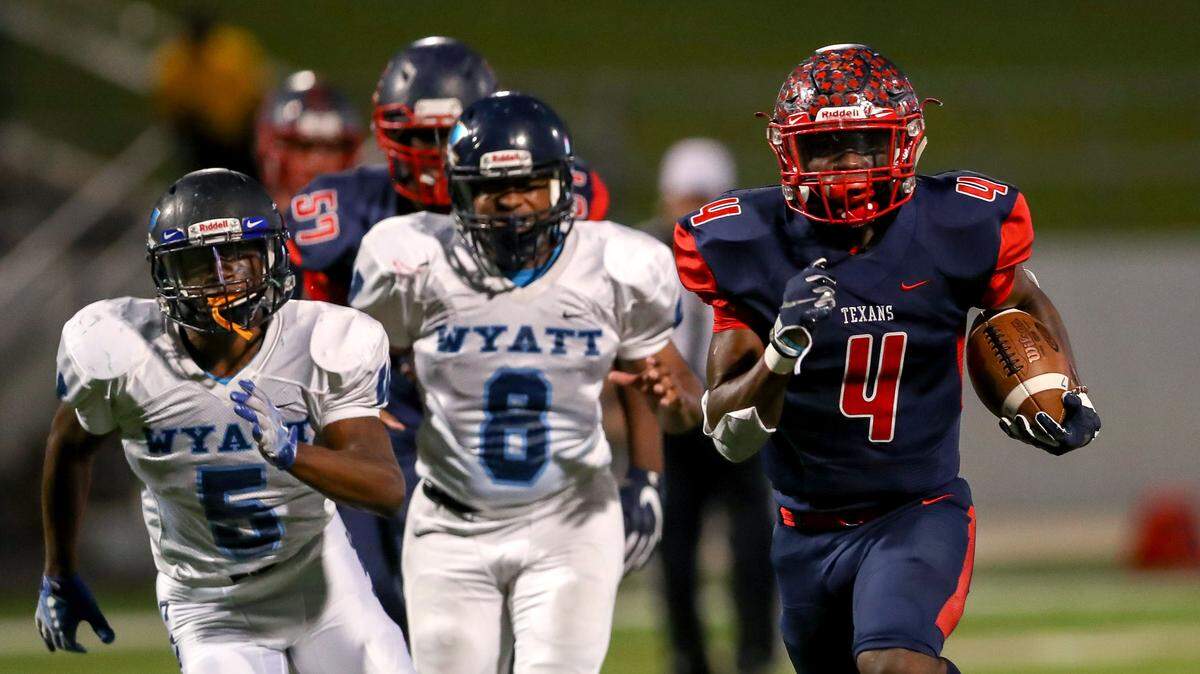 Justin Northwest running back DeMareus Hosey (4) runs for three touchdowns in the first half against O.D.Wyatt, Thursday night, October 11, 2018 played at Northwest ISD Stadium in Justin, TX.