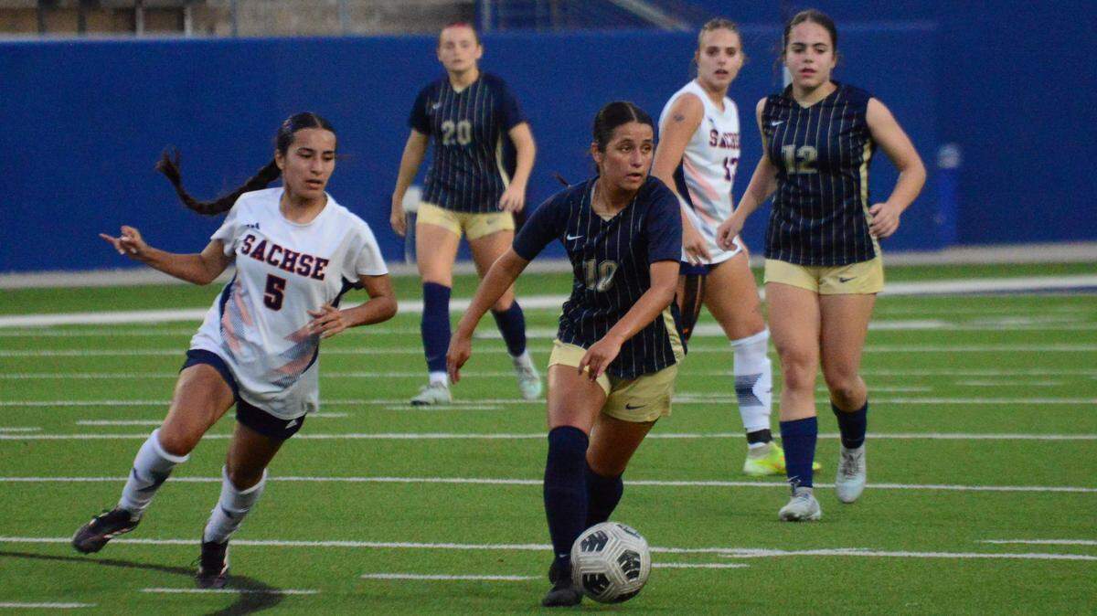 Keller’s Mariela Lopez (10) looks to pass as teammates Billie Davis (20) and Caroline Kraftson (12) look on while Sachse’s Emma Ramirez (5) chases and Clara Dowdle (13) follows in a Class 6A Division I state semifinal on Thursday at McKinney ISD Stadium.