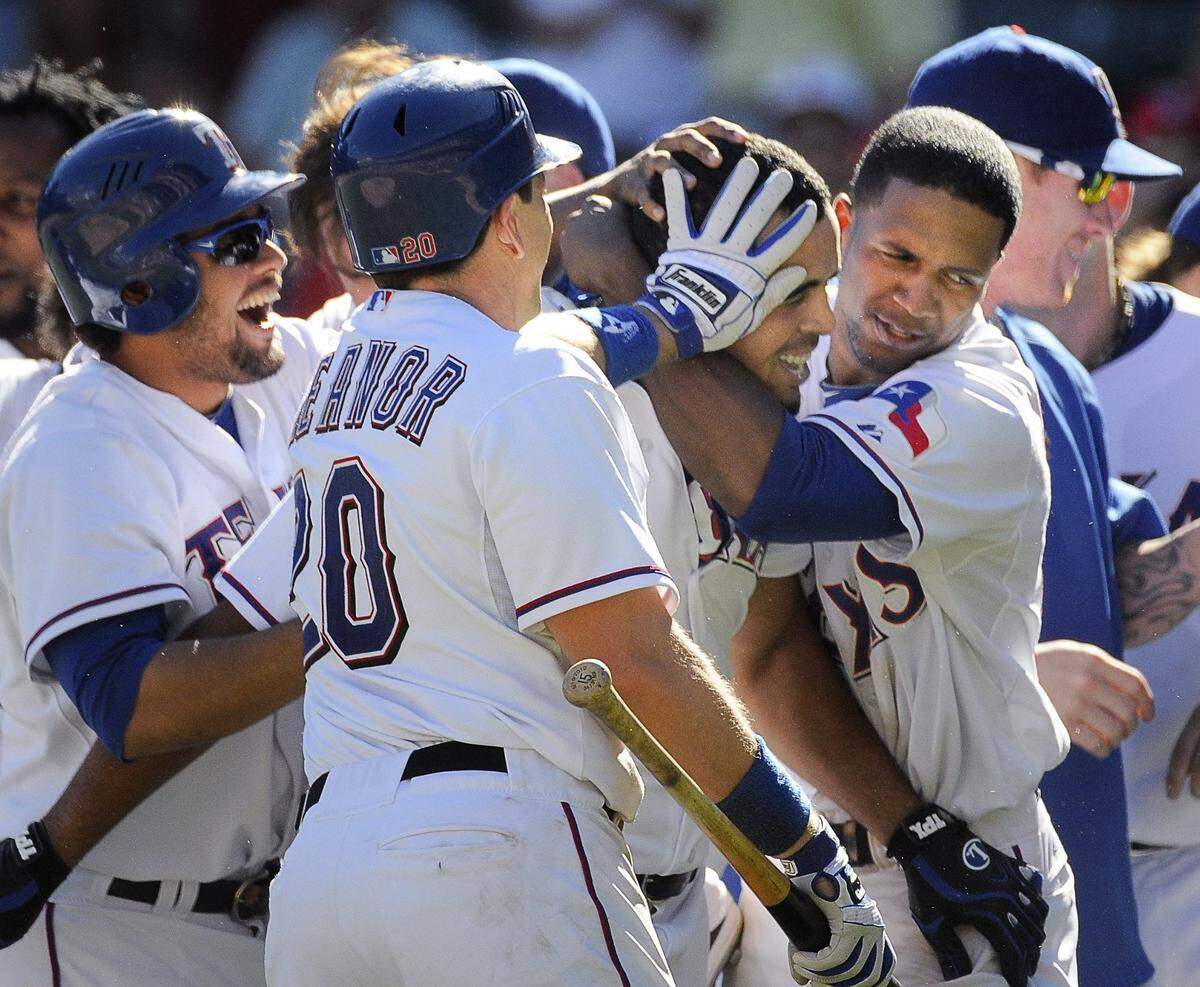 2010: Texas Rangers right fielder Nelson Cruz (17) celebrates with second baseman Andres Blanco (3), catcher Matt Treanor (20), center fielder Julio Borbon (29) and others after Moreland slid home safe for the final run of the game. Nelson Cruz struck out swinging, but Cruz was safe at first on a wild pitch. Seattle Mariners lost to the Texas Rangers 6 to 5 at the Rangers Ballpark in Arlington