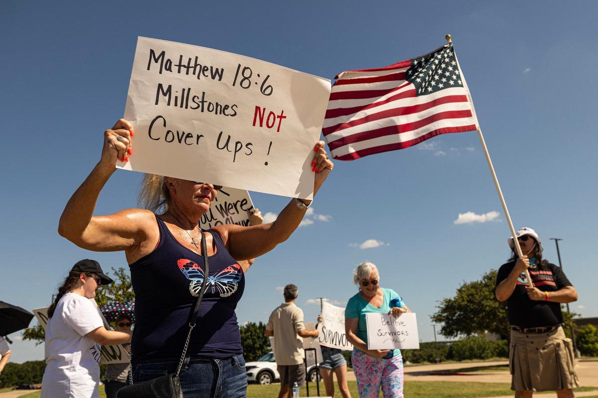 Lorie Jordan-Rice and others gather in protest outside of Gateway Church in Southlake in June.