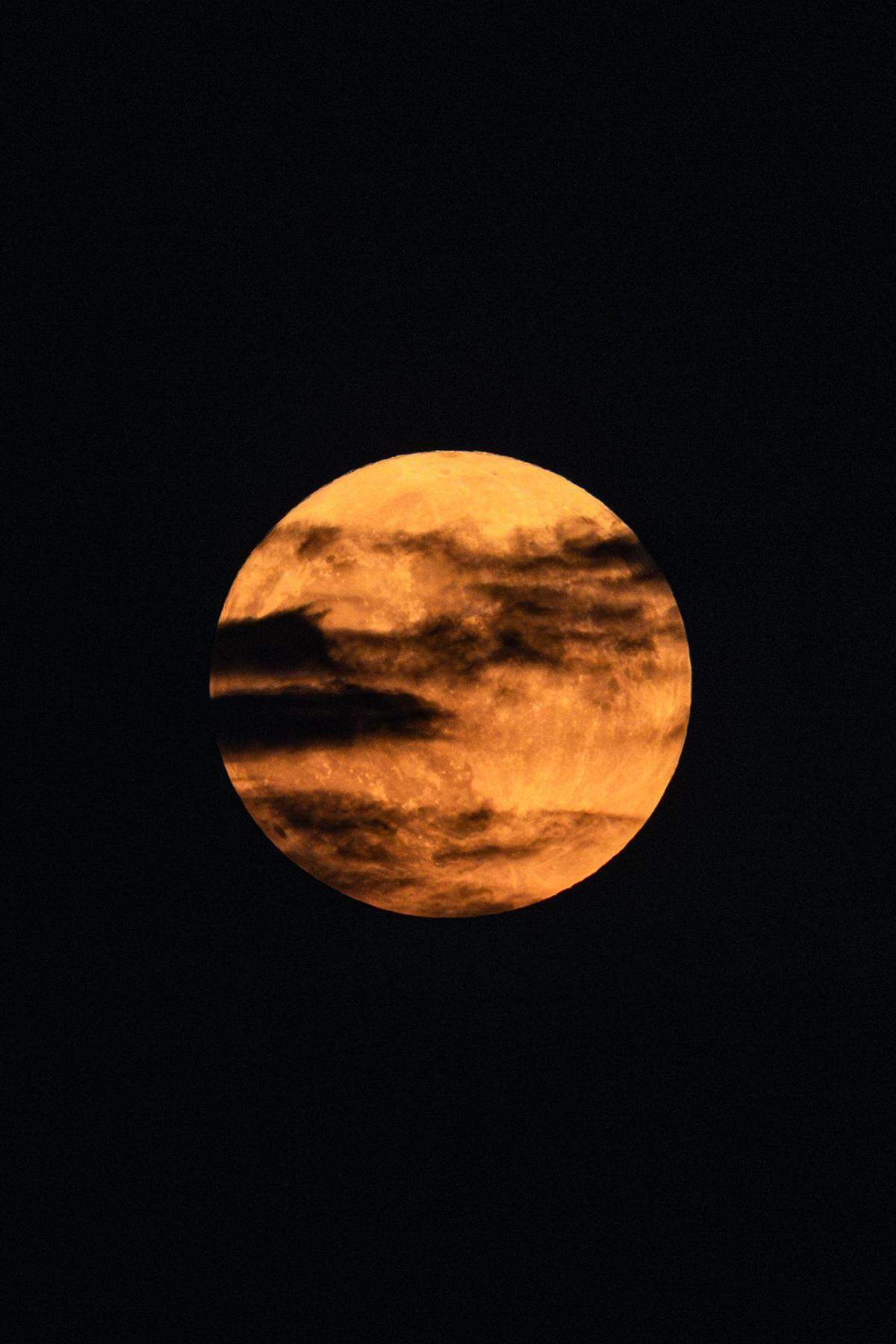 The Super Blue Moon rises over downtown Fort Worth on Wednesday, Aug. 30, 2023.