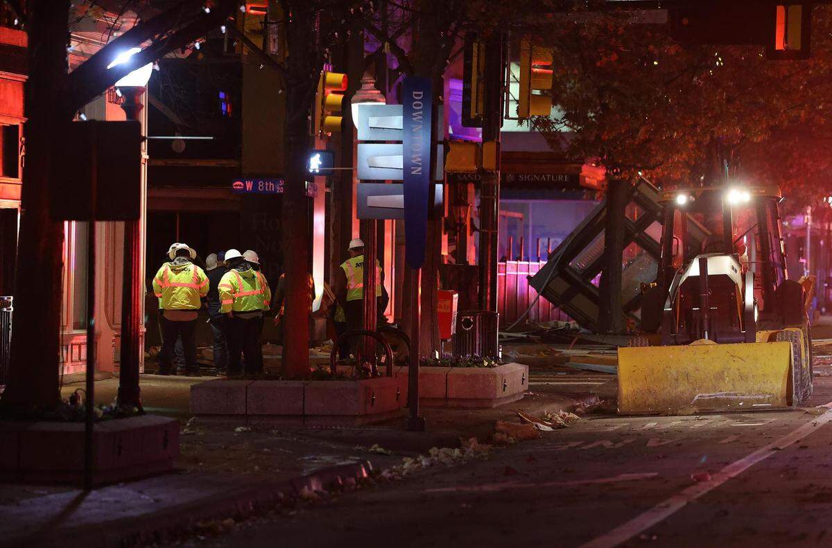 Atmos Energy employees are on scene of a massive explosion at the Sandman Signature Hotel in downtown Fort Worth on Monday, January 8, 2024. At least 21 were injured in the explosion.