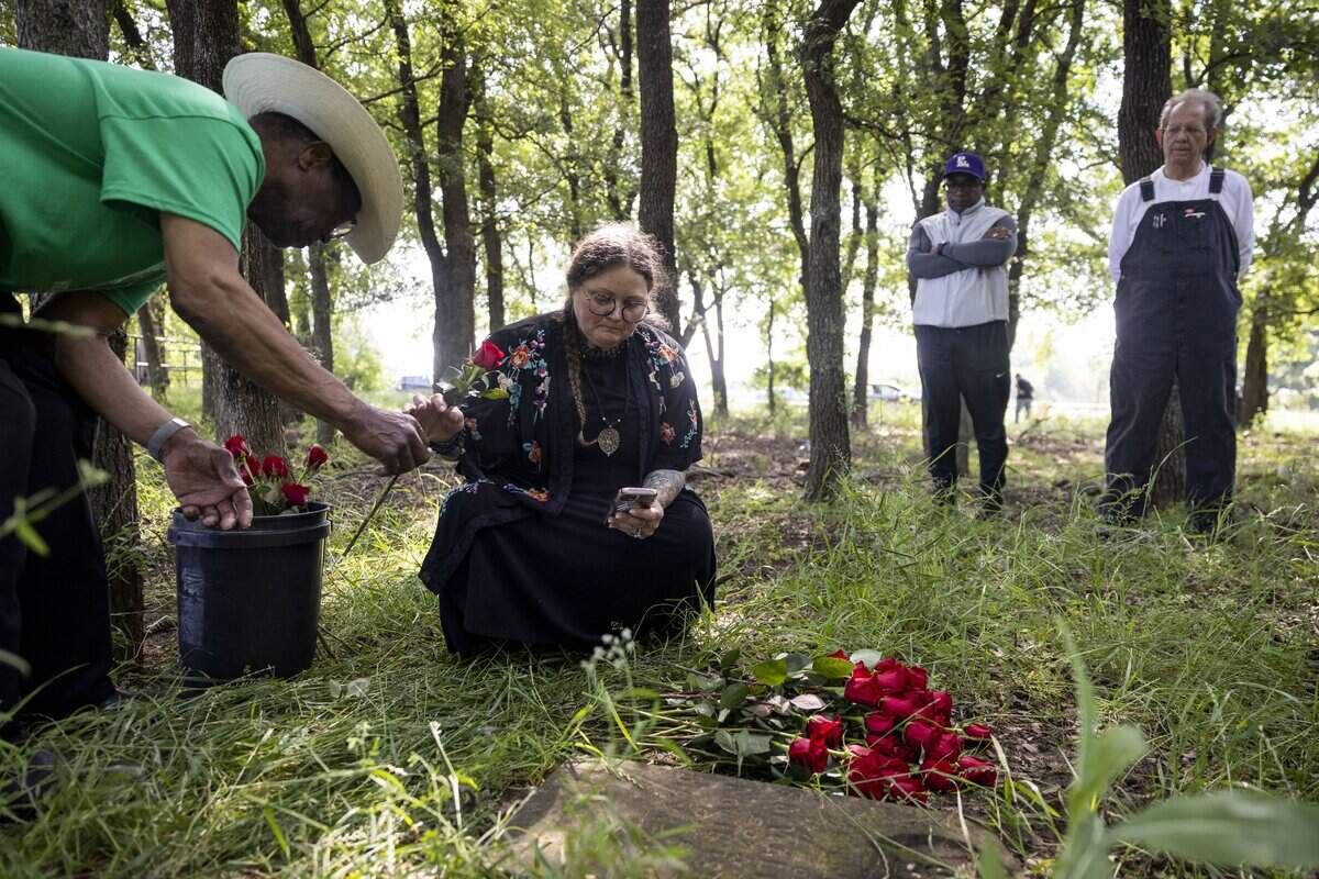 Jessica Luther Rummel reads the names of those known to be buried in St. John's Cemetery on Saturday, May 9, 2026, in Pilot Point, Texas. The cemetery is the last remaining evidence of the St. John's freedmen settlement community.