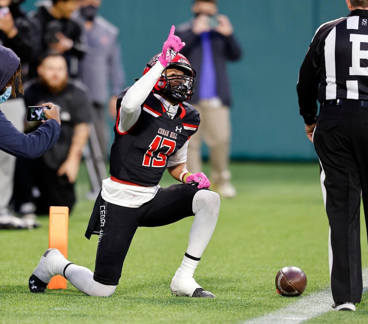 Cedar Hill wide receiver Javien Clemmer (13) celebrates his game tying touchdown during the 6A division 2 quarterfinals at Globe Life Park in Arlington, Texas, Saturday, Jan. 02, 2021. With the game tied 21 after regulation Cedar Hill defeated Rockwall Heath 27-24. (Special to the Star-Telegram Bob Booth)