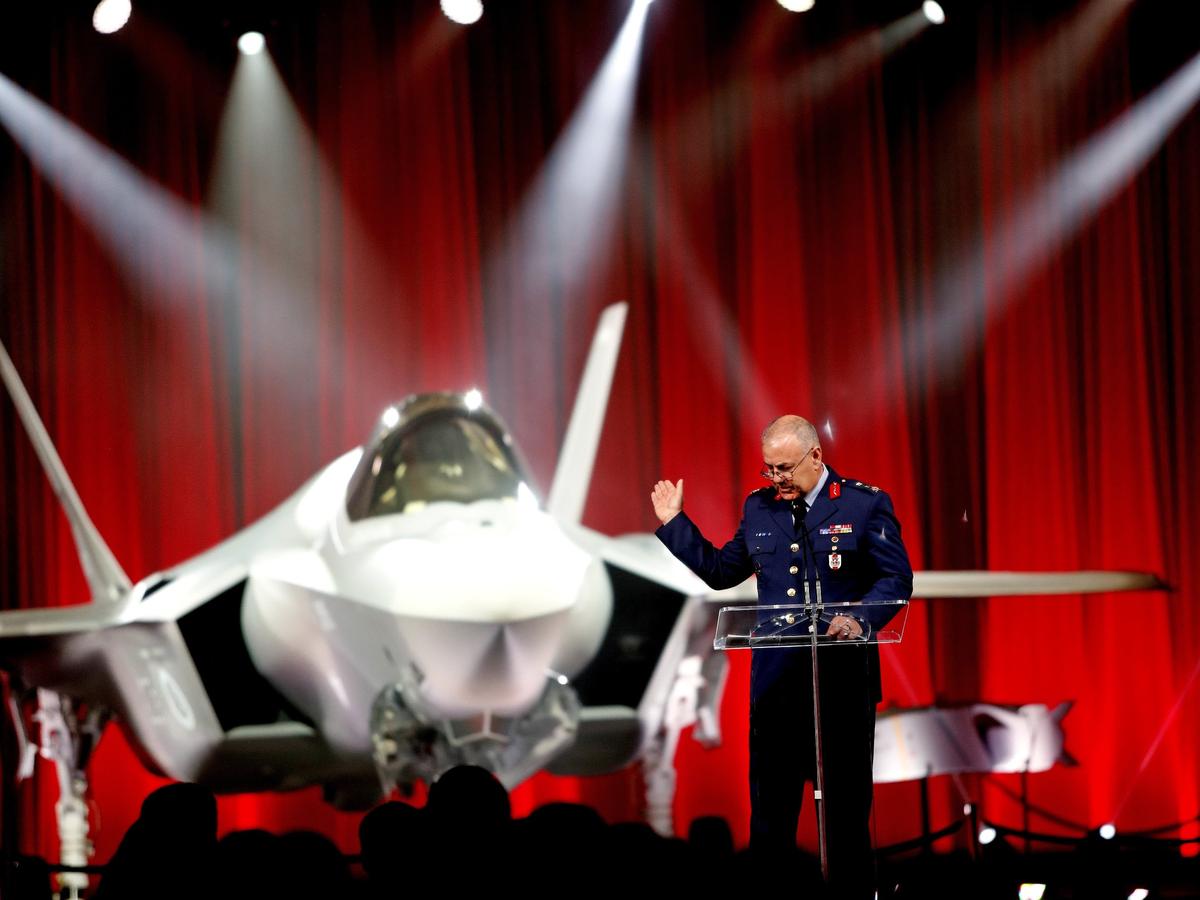 Major General Reha Ufuk Er, the Force Development and Resource Management Director Turkey General Staff J-5 Directorate, speaks about the F-35 behind him during the Republic of Turkey F-35 rollout celebration at Lockheed Martin Thursday June 21, 2018. Dignitaries, Martin employees and media from both the US and Turkey attended the event.(Bob Booth)