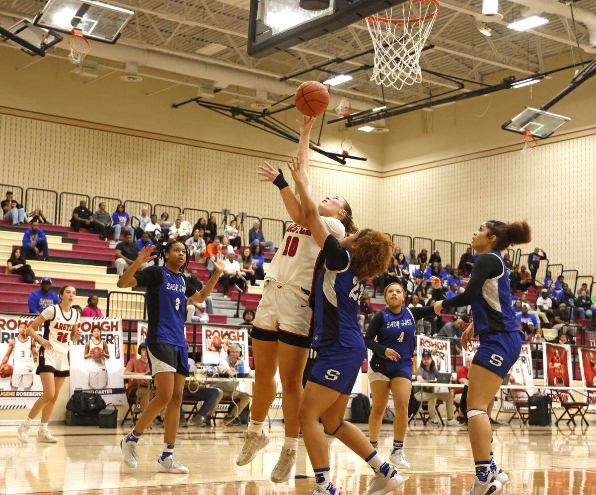 Argyle forward Emma King (10) shot was called off for charging against Mansfield Summit during the second half of a UIL Class 5A DII girls playoff basketball game at Saginaw High School in Saginaw, Texas, Thursday Feb. 19, 2026.