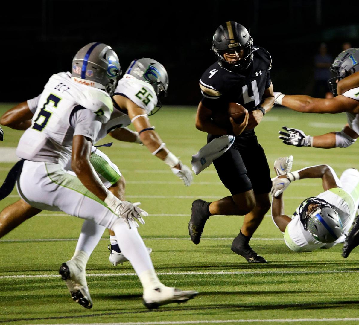 Keller Fossil Ridge quarter back Logan Cundiff (4) cuts back to the inside in the first half of a UIL high school football game at Keller ISD Stadium in Keller, Texas, Thursday, Sept. 21, 2023. Haslet Eaton led 24-14 at the half.