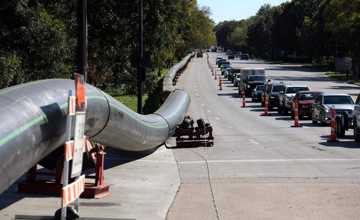 A large pipe runs along the northbound side of University Drive on Tuesday, October 17, 2023, in Fort Worth. The two right lanes were closed for construction from around Trinity Park Drive to Trail Drive.