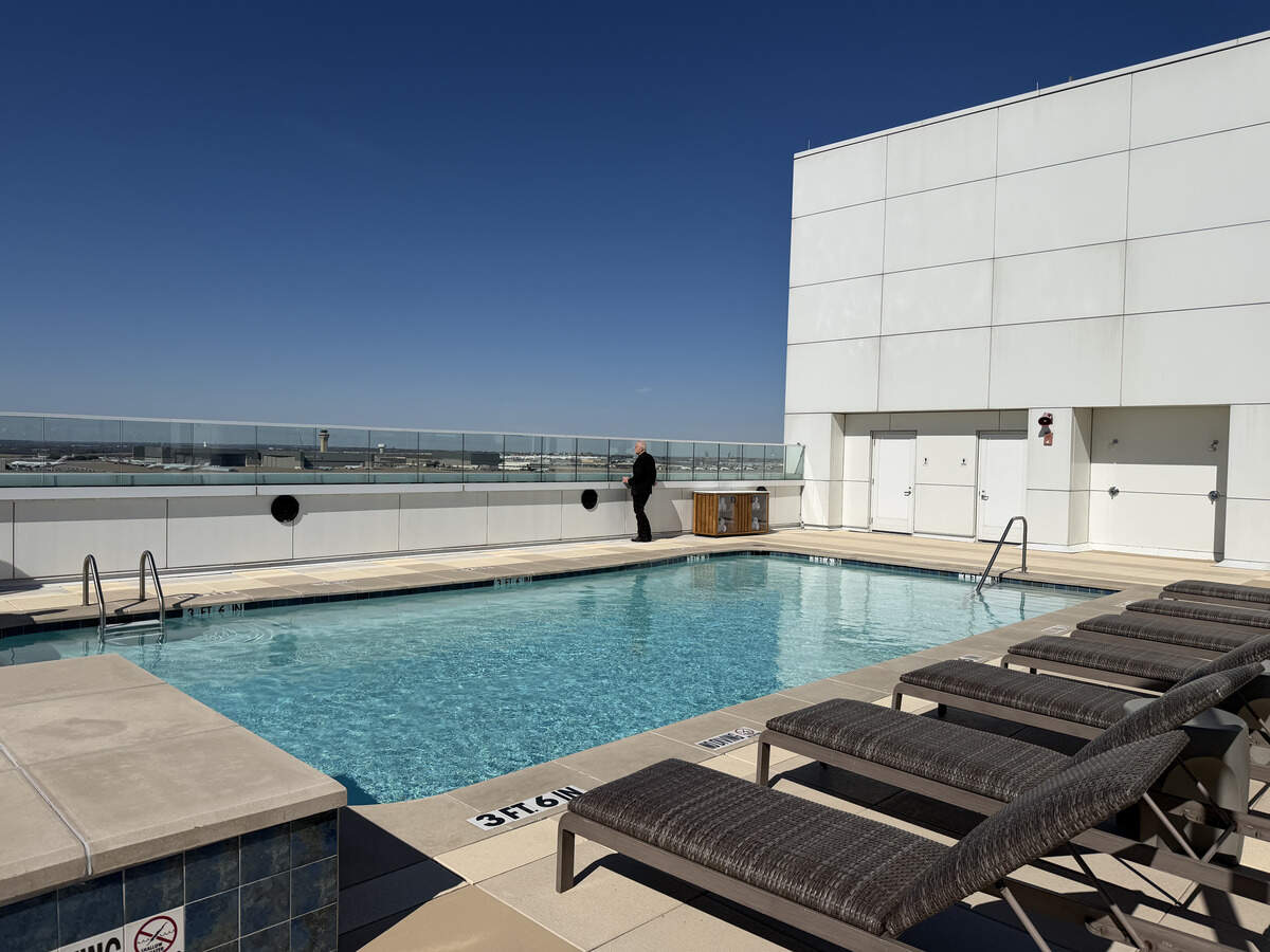 The new top-floor “Flight Deck” at DFW Grand Hyatt features a rooftop pool with runway views.