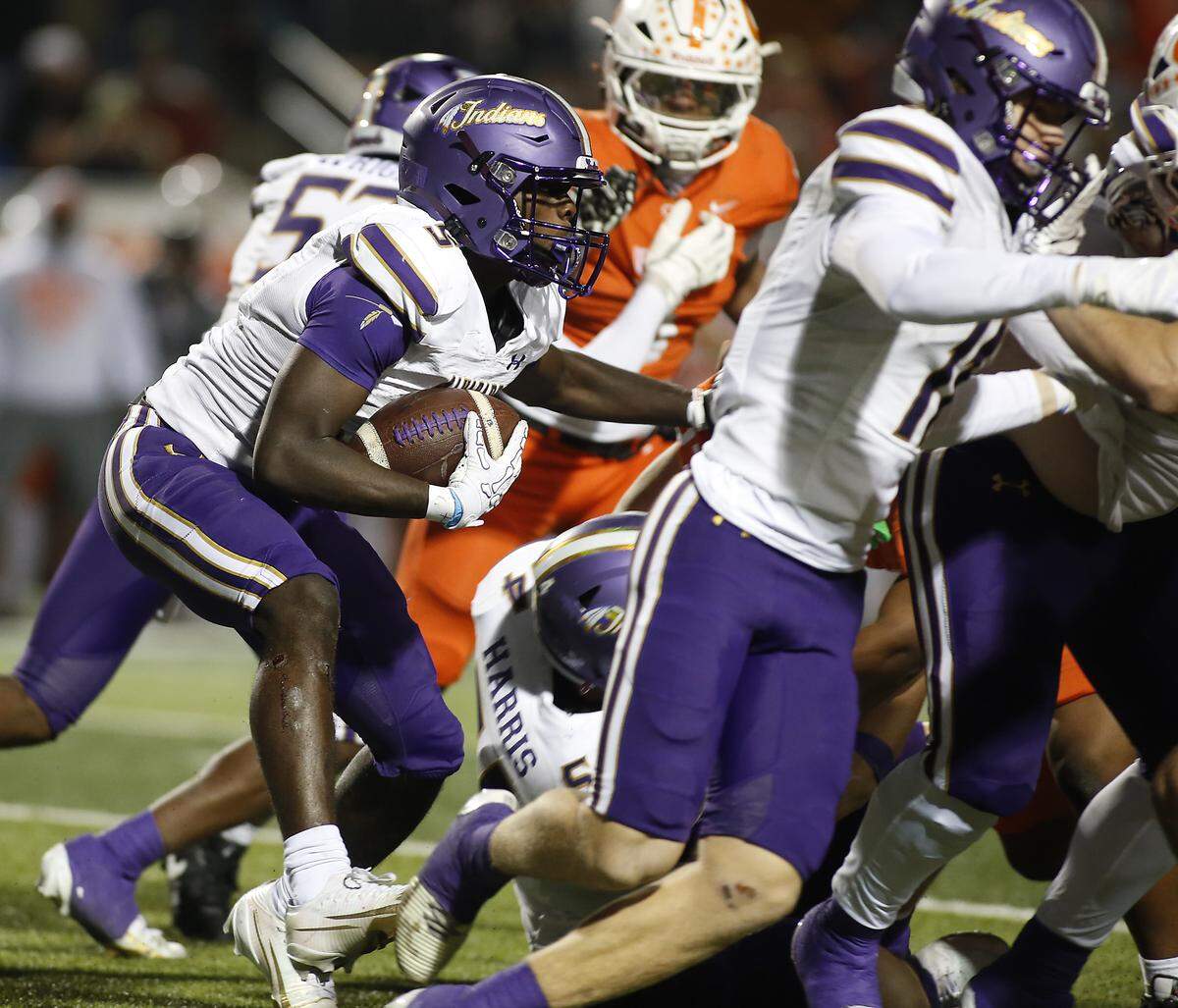 Alvarado’s Demarcus Belton can’t find a hole in Celina’s defense during their Class 4A Division I quarter-final game at Newsom Stadium on Friday, December 5, 2025, in Mansfield, Texas.