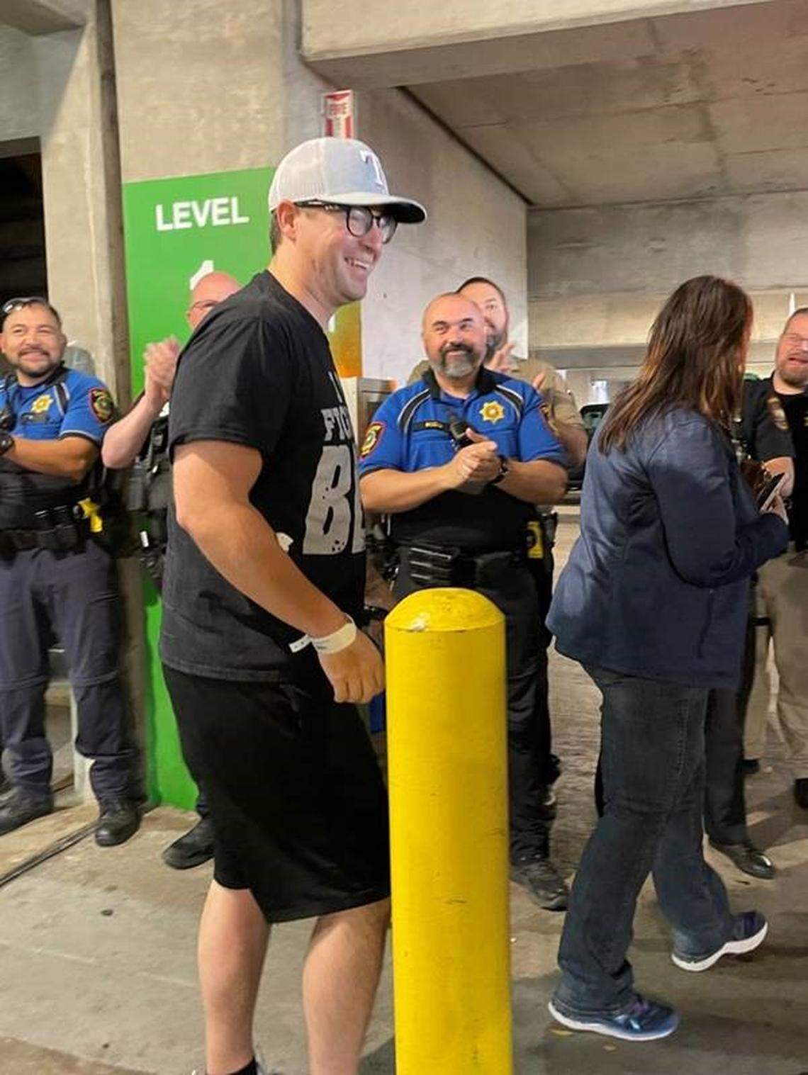 Tarrant County Sheriff’s Deputy Brent Brown walks away from John Peter Smith Hospital in Fort Worth on Friday, Dec. 8, 2023.