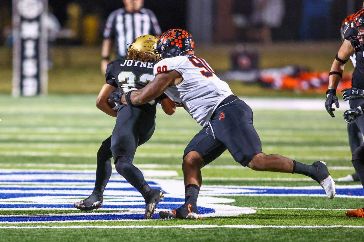 Aledo defensive tackle Tymon Meeks tackles Abilene running back Ethan Joyner in the Friday, Nov. 22 playoff game at Newsom Stadium in Mansfield. Special to the Star-Telegram / Tom Marvin